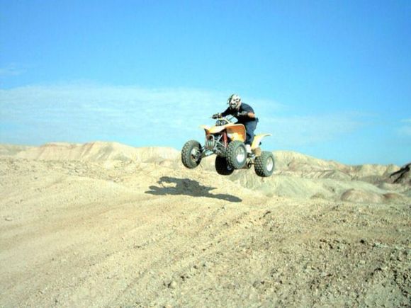 Chris jumping his 400ex.                                                                                                                                                                                
