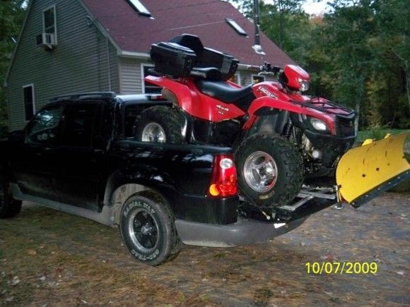 Loading the King 700 into a Ford Sportrak 4'bed... ;-)  Got some strange looks- (my trailer had a flat)