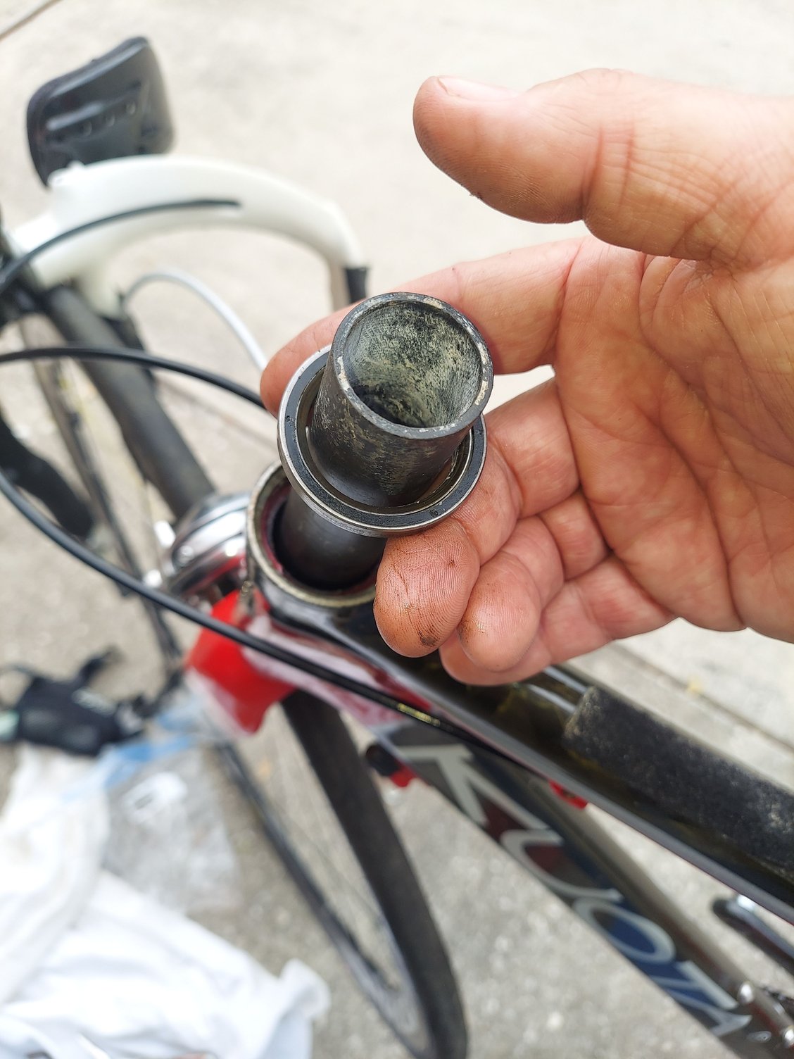 Here I am showing the lower bearing up top so I could photograph it . And you can see its quite larger then the forker steer tube .