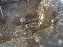 Excavation under driveway found this. A third clean-out that was filling up with gravel regularly until it failed.