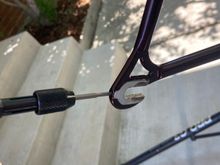Chasing these threads and switching to the shortest 3mm hex bolt that allows for adjustment of the wheel for centering will save you a lot of headaches.