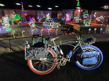 My chrome cruiser festooned with lights