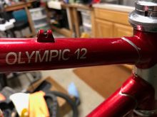 Olympic 12 logo, and head lugs with silver lining
