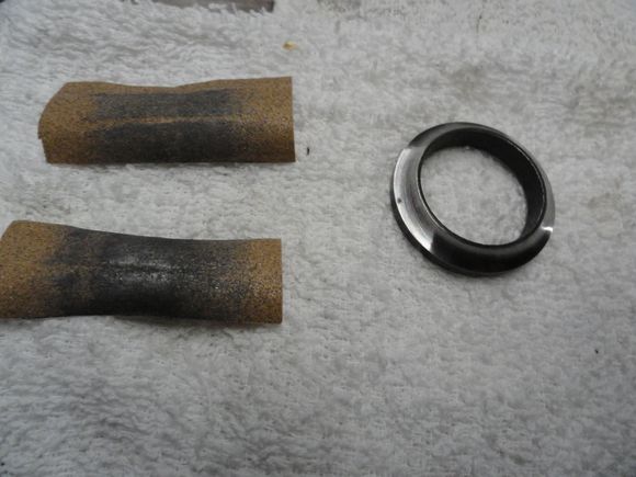 Two passes with 220 grit paper to remove damage to the race.  Paper show the amount of material removed.