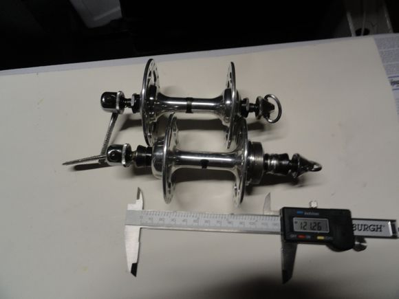 Set B:   Campy Record high flange hubs Straight levers and old skool caps.  36 hole 121 over-nut length.  $150 by USPS shipping.