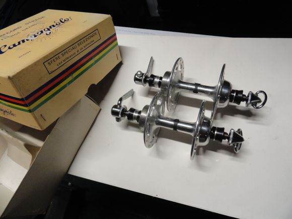 New Old Stock 28 hole high flange hubs (rear only!).  Straight skewer levers make them NR models.  