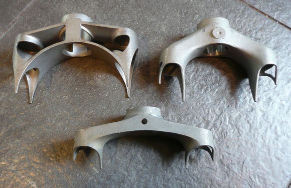 Bottom one is an early-'80s Cinelli OR that I modded, adding some here, machining away there, lighter overall.