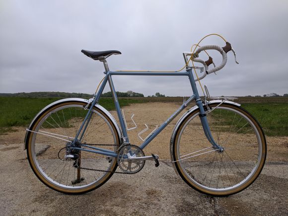 This is the bike's current configuration. I got tired of looking at the shoddy paint, so the bike was powdercoated. I also wanted to try out 650B wheels, so the bike currently has 650Bx38C tires. Smaller wheels gave me room for fenders, and the front rack was added to let me carry a big rando-style bag.

I love this bike in this configuration. It keeps all the liveliness of the original, but the ride is as smooth as could be.