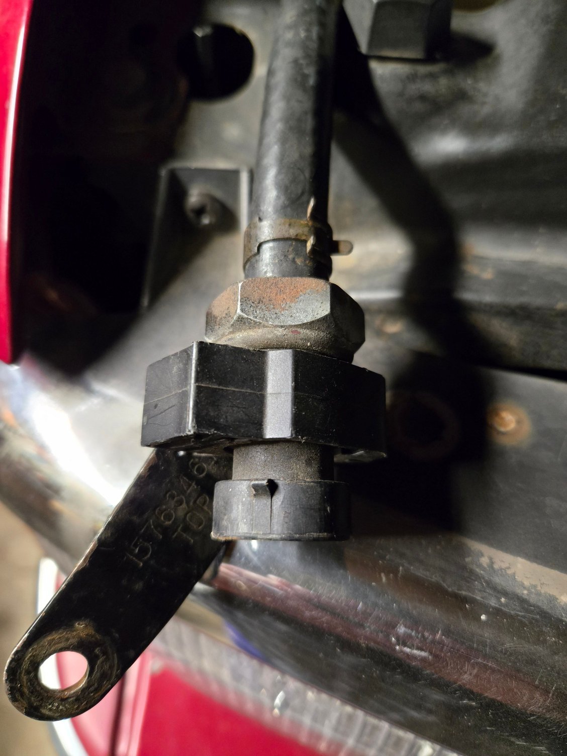 1995 Blazer LT ...Anyone know what this is and where it is mounted?  It has a vacuum hose on one end that runs to a tee that is connected to the 4WD acuiator.  The number on the bracket is 15763467 and it says TOP.