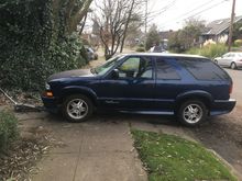 This is how I want to jack it up. Is this dangerous? I don’t have a lot of options and this would give me the most space to work and lift. So I’m going to try to lift it and put the jack stands on the level part of the sidewalk. Is this a good idea? 