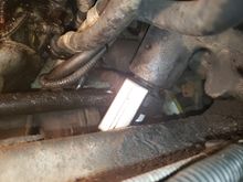 Using the tie-rod puller on the steering gear shaft.