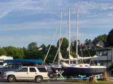 Rigging the sailboat before launching in Bellingham Bay, Washington.