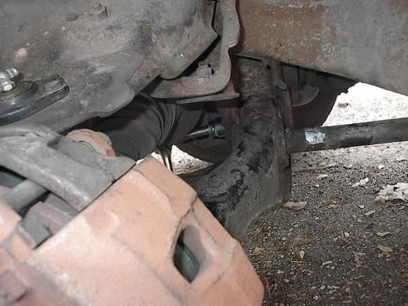 This is the best image showing how to get the ratchet on the nut for the rear bushing. I took it out with the ratchet on the back of the bolt (to the right).