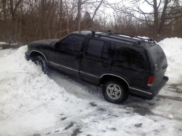 climbing a small snow pile