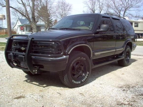 spring clean up. I painted the stock rims with semi-gloss rustoleum spray paint, and I also painted the grill also. I also added coil overload shocks on the rear to level it out.