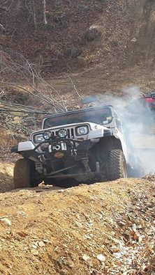 Smoking up the mud tires on a rock hillclimb.