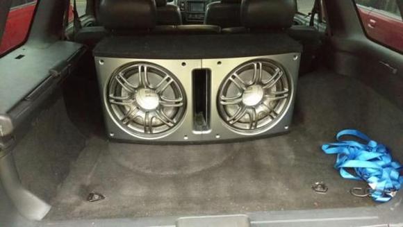 Polk DB212-2. 
750 watts RMS at 2 ohms

And yes before anyone says it, this is a Polk kit box. The subs and box did come together exactly as you see it. No custom work here.

Alpine MRP-M650 amplifier mounted to the back of the box.