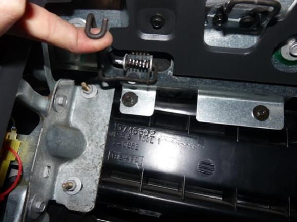 14 - This spring is the glove box catch, lift it to drop box