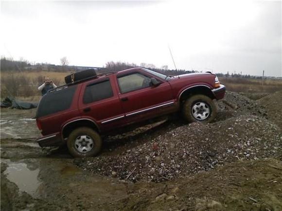 Before the front end upgrade.  2 inch body, cranked up torsion bars, lifter springs in the rear.  31x10.5 BFGs.  Full sized spare on roof.
