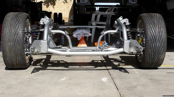 TCI subframe with connectors to TCI 4 link. Polished A-arm, Coil over shocks, polished calipers with polished billet backing plates.