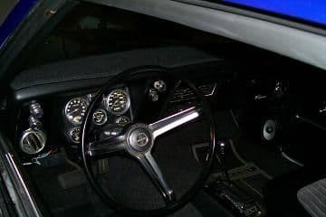 Went with Covan Classic Gauge Cluster. Still looks clean, but supplies much more info then the original gauge cluster.