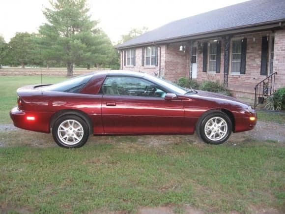 My first Camaro.  02 3800 V6/A4.  Burgundy w/ gray cloth.  T-tops.  Sold it in 2008.