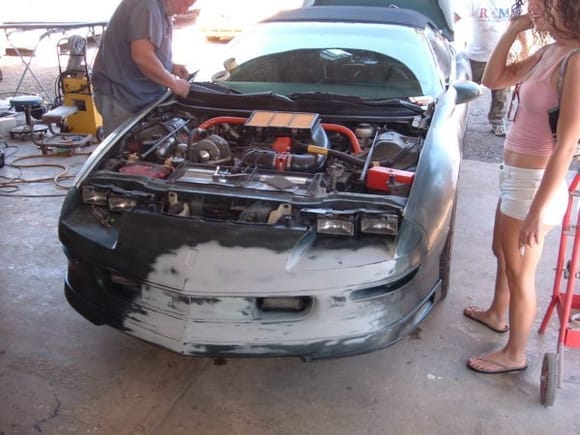 After a few minor incidents, some insurance money, I was able to get a SS hood and high rise spoiler and get the whole car repainted and put together.  That's my wife on the right.