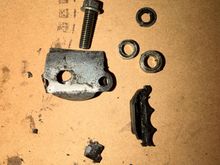 Found one of those thicker washer looking pieces in the oil pickup tube, the other one was still on the bolt holding in the metal piece. 