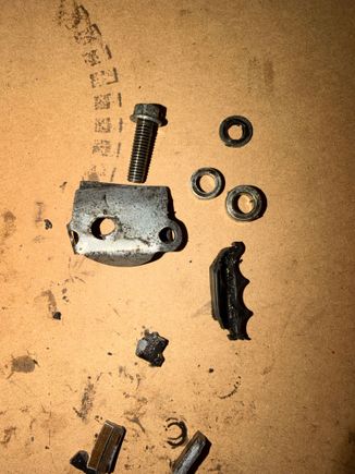 Found one of those thicker washer looking pieces in the oil pickup tube, the other one was still on the bolt holding in the metal piece. 