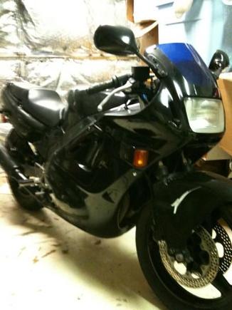 The Batcycle in all it's glory resting in the Batcave.