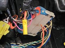 Orange wire burned in two at the pins under dash on driver side.  Clip both sides, bypass the plug!  Presto!!!!!    Working rear fan!!     