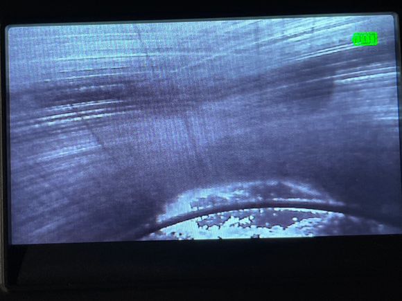 Closeup of shiny part on piston 2 with cylinder wall. You can see the cross hatching and vertical scoring. 