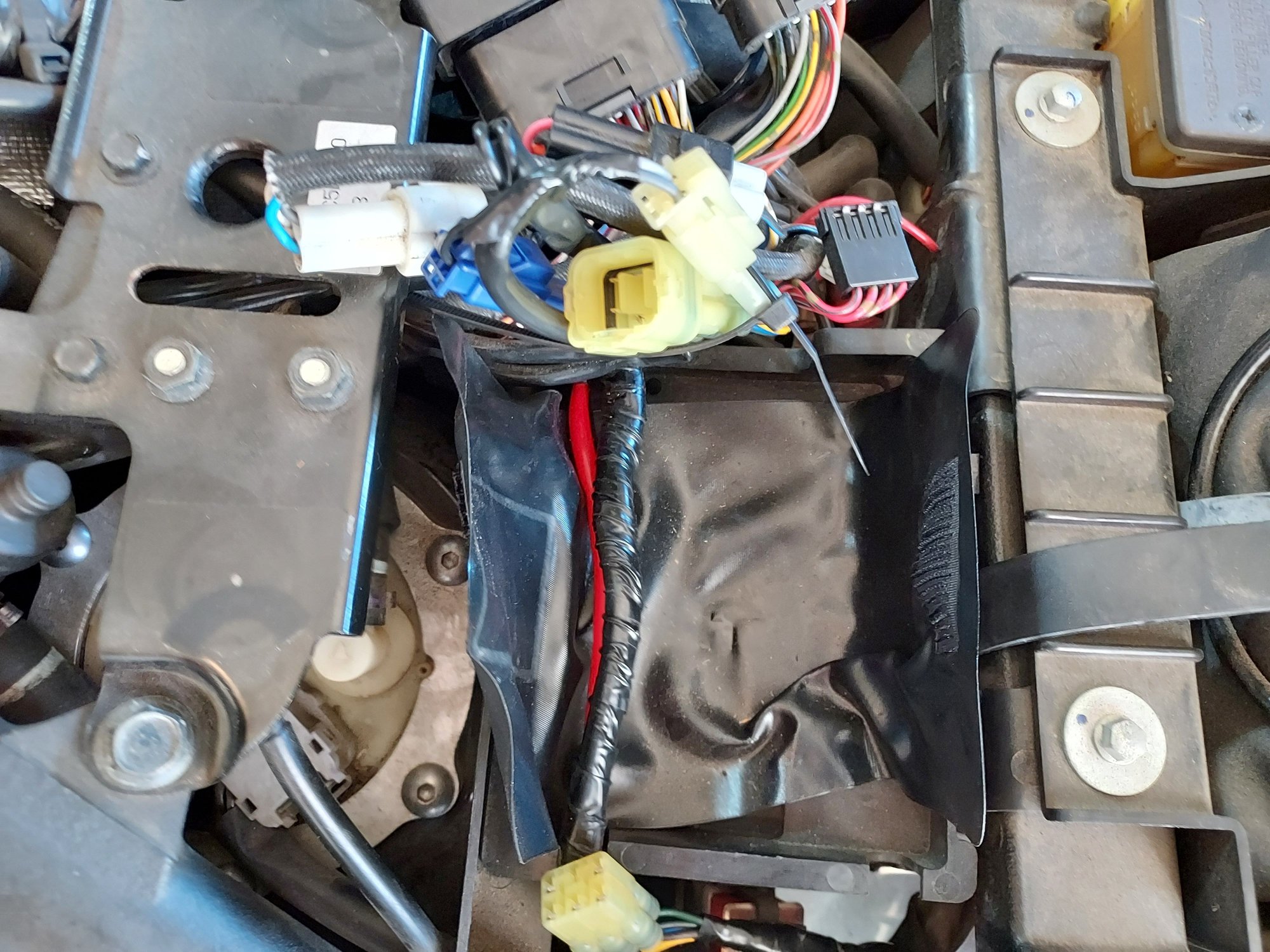 With all the 2nd Layer wiring peeled back.  Next step is to remove the tray the wiring was sitting on.  It just pulls out towards the rear.  Battery is located directly beneath the tray.