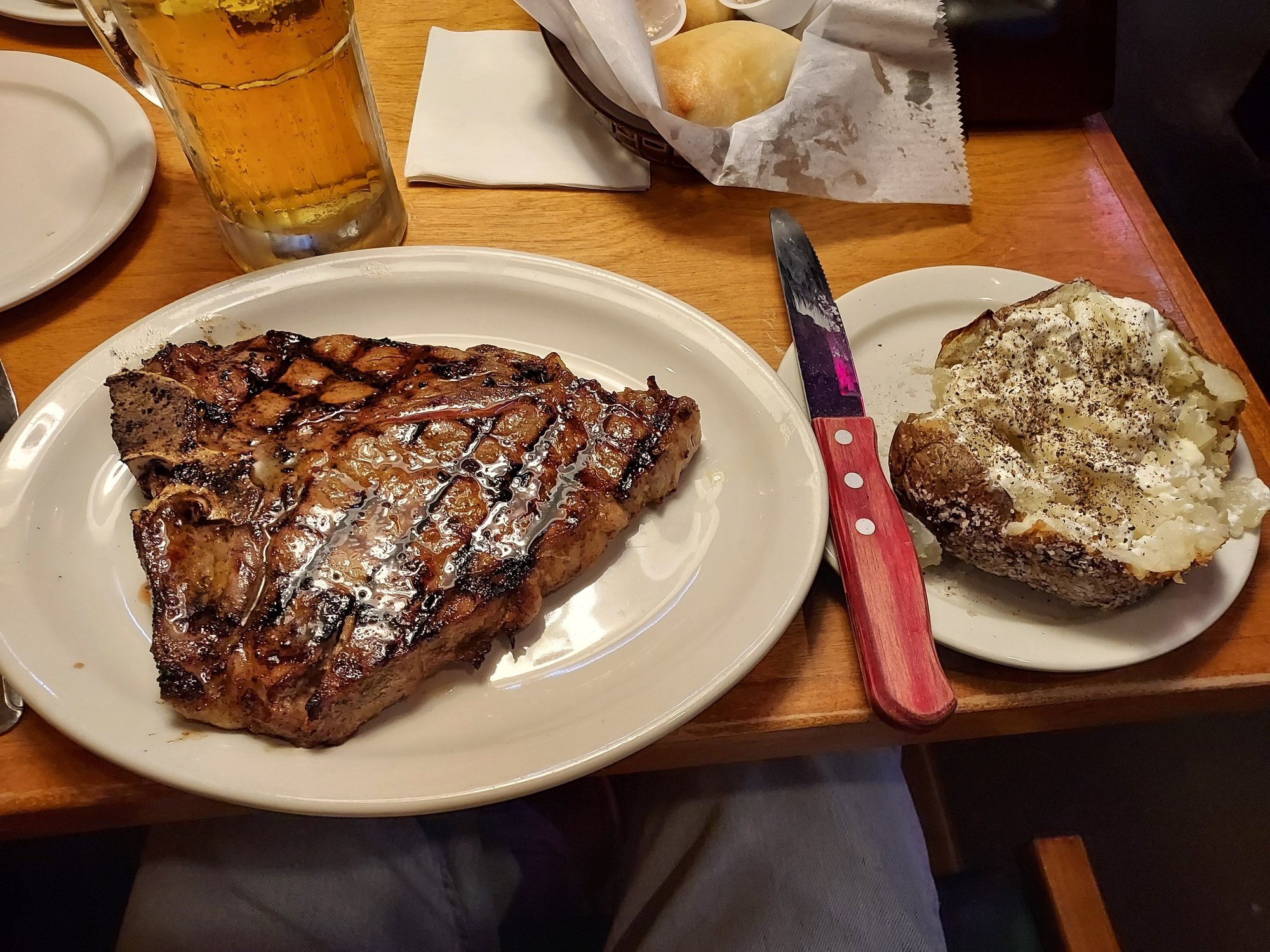 I had their House Salad with extra Bleu Cheese dressing, Baked Potato with butter and Sour Cream, their 24oz. Porterhouse,  and 6 of the rolls with honey butter.  Plus I had a 16oz. Busch draft.