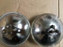 These are both bulbs. The new one is on the left and the old one is on the right. On the right you can see where the old one had to be modified and had the lips shaven down.