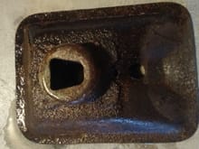 Jack baseplate, wet from rinse, showing rust prior to de-rusting