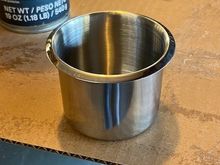 These are the stainless cup holders I bought on Amazon; they are 3.15" OD (lip-to-lip), 2.13" ID and fit into a 2.75" dia. hole.  I used a Milwaukee hole saw to make the cutouts.