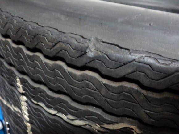 Close up of notched tire edge on 22 week 1972 tire.