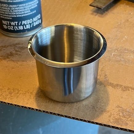 These are the stainless cup holders I bought on Amazon; they are 3.15" OD (lip-to-lip), 2.13" ID and fit into a 2.75" dia. hole.  I used a Milwaukee hole saw to make the cutouts.