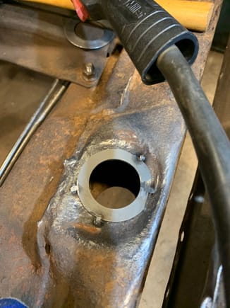 Welding in washers to repair holes. They looked decent until I grinded the rise off. 