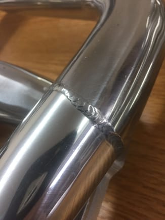 Close up of one of the two butt welds on the pipe. You may or may not like this. I will match well with your sheet metal intake and welded aluminum valve covers. Of course with that setup you’ll want 2” headers.