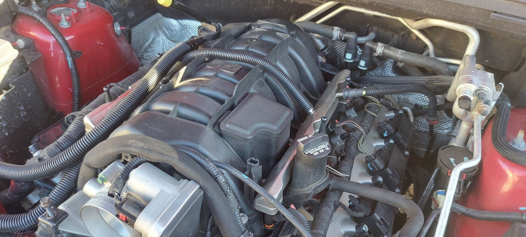 I had to make a new fuel line to reach the other side.  I wanted to have the nylon style tubing like OEM but had to settle for 100 psi fuel injector hose fitted to a 90degree and straight out fitting.  I did get fuel line hose clamps - not typical worm clamps as I had one of those leak once.