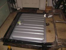 22 gallon tank from a 70 mustang. I didnt like the idea of a 15 or 16 gallon tank. I dont know what the gas mileage is on a carbureted 318, but Im sure it sucks. 