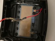 This is the back of the steering wheel pad.  You can see the test clips attached to the two wires.