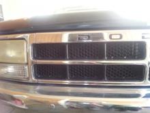 Honey comb mesh grill from a dodge ram cut to inserts and painted satin black.