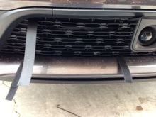 feed non adhesive backed Velcro through lower grill loops