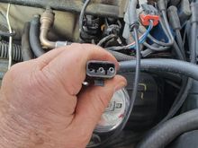 Trying to show the little plastic lever holding pins in. Use small screwdriver, lift lever-carefully, use your little finger and ring finger to pull pin out.