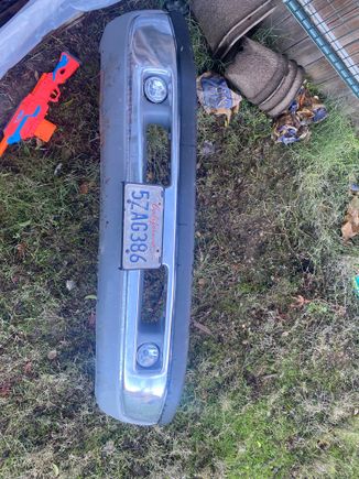 As luck would have itt my neighbor had a spare bumper he traded to me for a case of  beer.  Here it is with my license plate added. Looks like I get to add fog lights to the truck