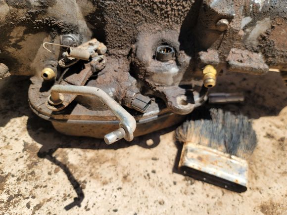 I suspect the two brass fittings indicate hydraulic actuation? 