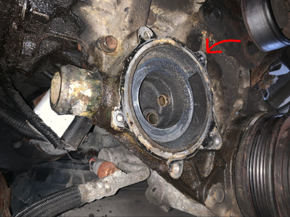 The red arrow points to where the bolt broke, still lodged in the housing. 